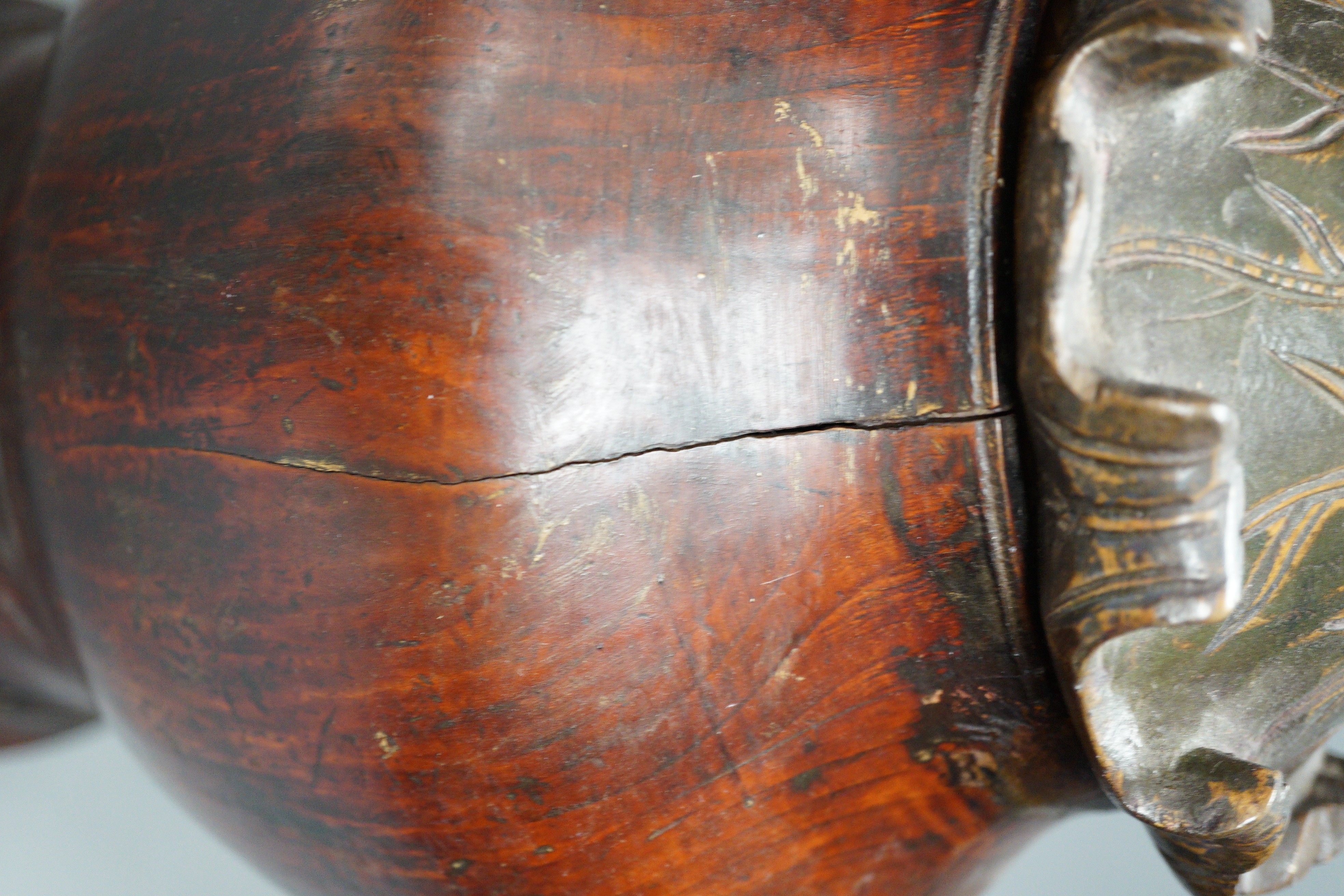 A Chinese carved wood jar and cover, 33cm